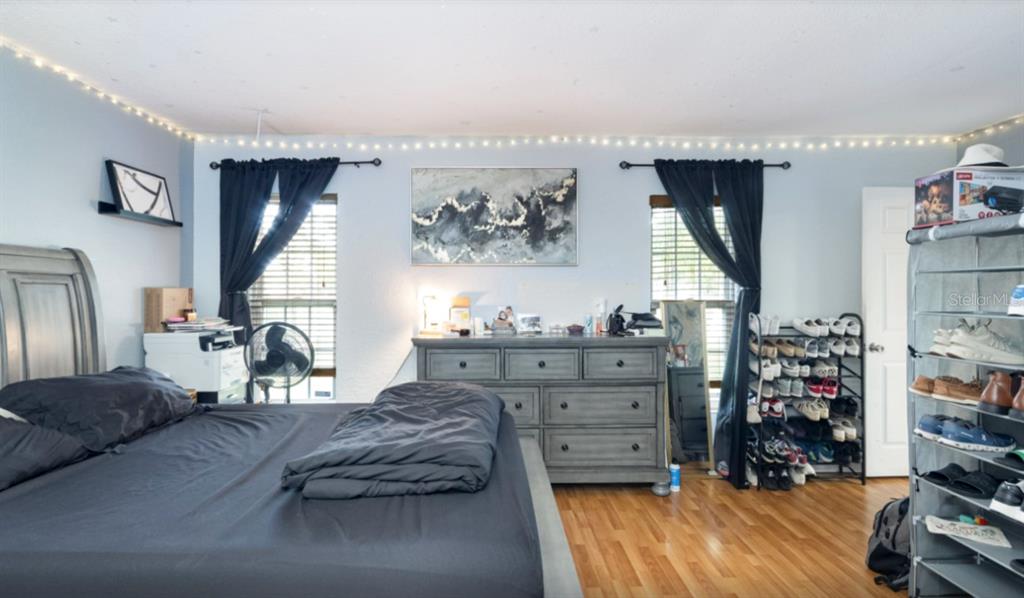 3818 Laso Way Orlando, FL 32822 - Photo 17 of 19 a bed room with a bed and a window