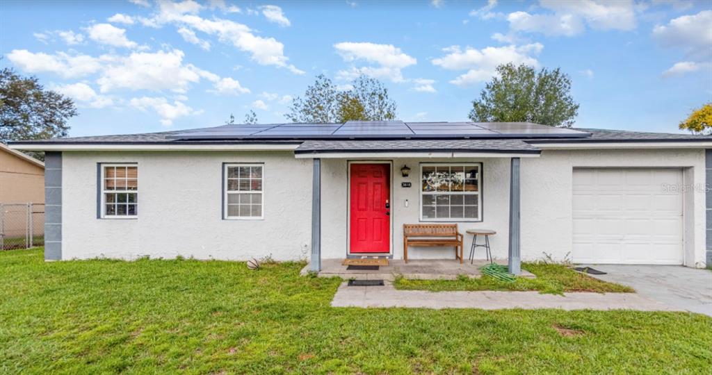 3818 Laso Way Orlando, FL 32822 - Photo 2 of 19 a view of a house with a yard
