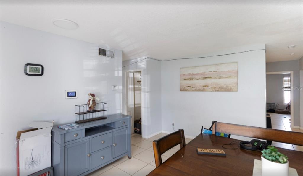 3818 Laso Way Orlando, FL 32822 - Photo 5 of 19 a kitchen with stainless steel appliances cabinets and wooden floor