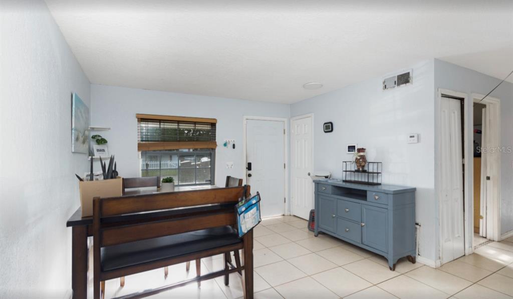 3818 Laso Way Orlando, FL 32822 - Photo 7 of 19 a room with furniture and window