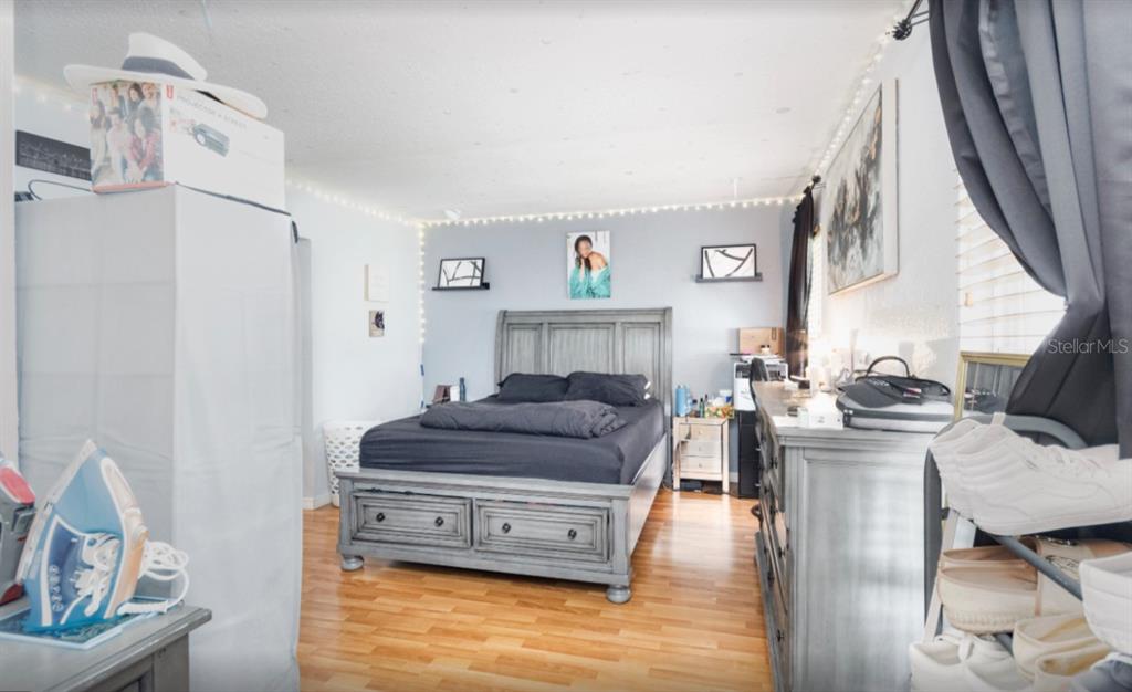 3818 Laso Way Orlando, FL 32822 - Photo 8 of 19 a living room with furniture and a fireplace