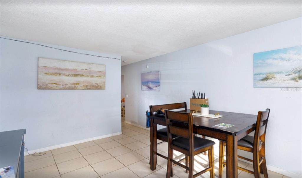 3818 Laso Way Orlando, FL 32822 - Photo 9 of 19 a view of a dining room with furniture