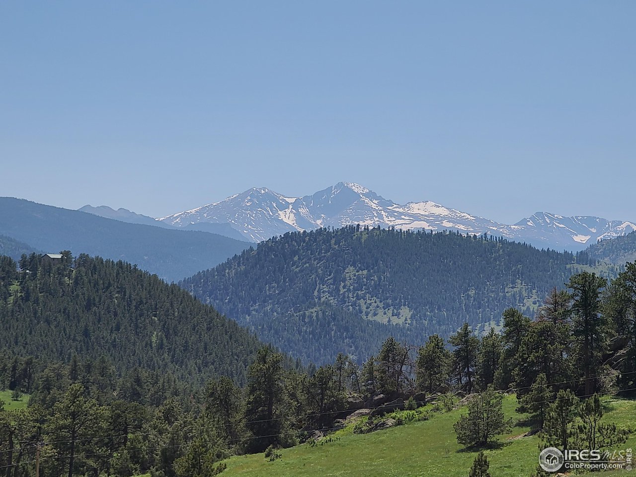 a view of a town with mountains in the background