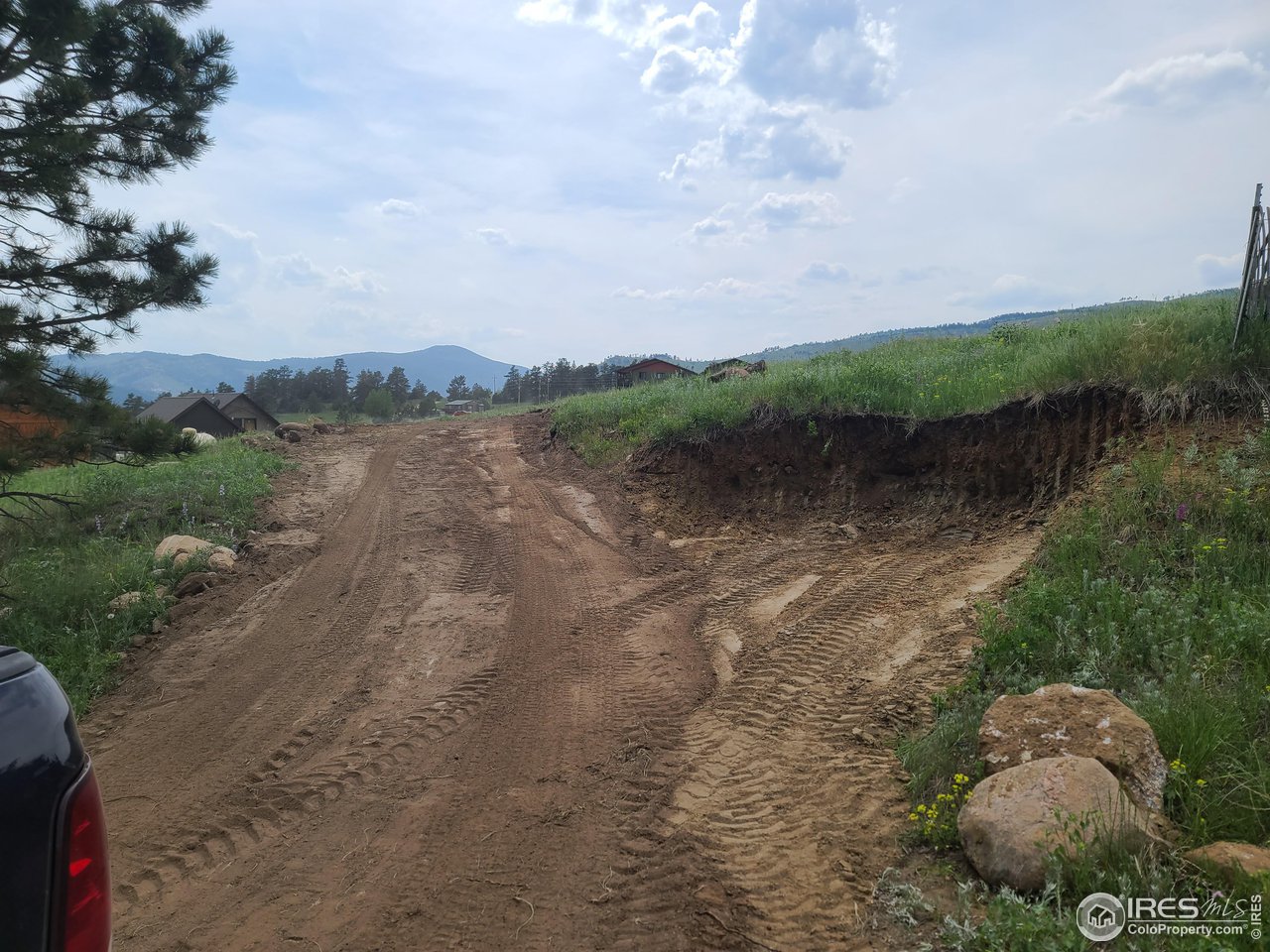 52 Buff Court Drake, CO 80515 - Photo 3 of 8 a view of a lake with mountains in the background