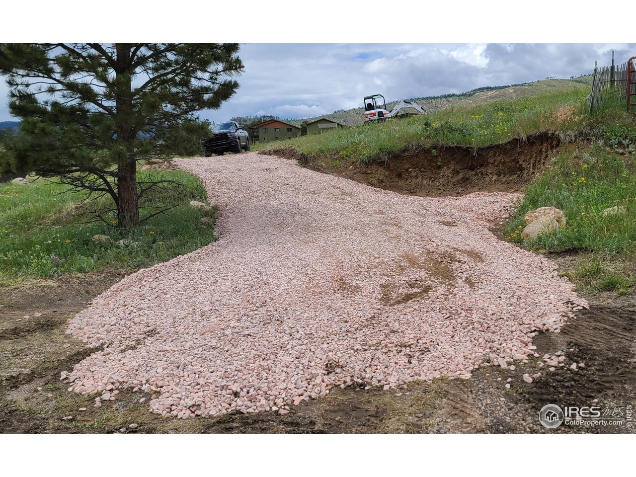 52 Buff Court Drake, CO 80515 - Photo 4 of 8 a view of a road with a building in background