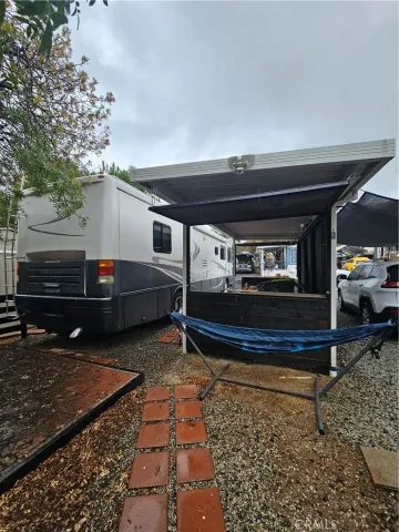 a view of a house with pool and deck