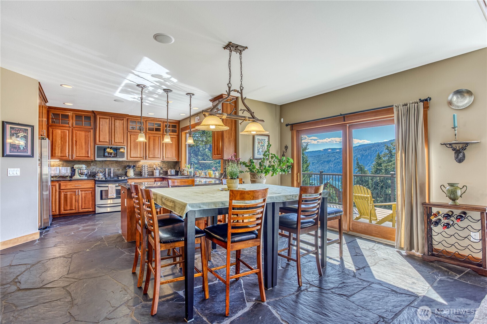145 Lava Lane Ronald, WA 98940 - Photo 12 of 39 a view of a dining room with furniture window and wooden floor