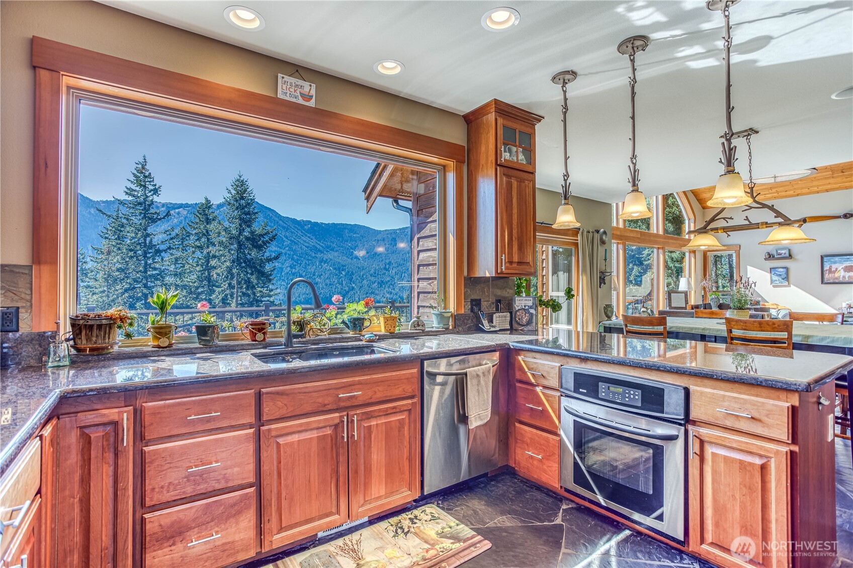 145 Lava Lane Ronald, WA 98940 - Photo 15 of 39 a kitchen with stainless steel appliances granite countertop a stove a sink and a microwave