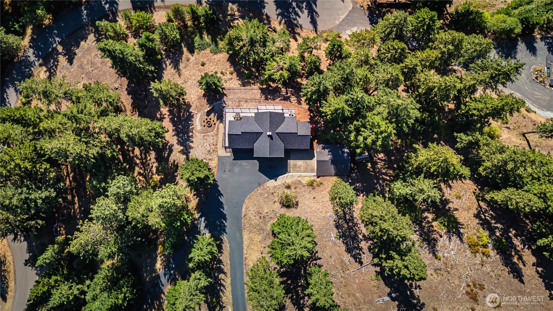 145 Lava Lane Ronald, WA 98940 - Photo 31 of 39 an aerial view of a house with a yard and large trees