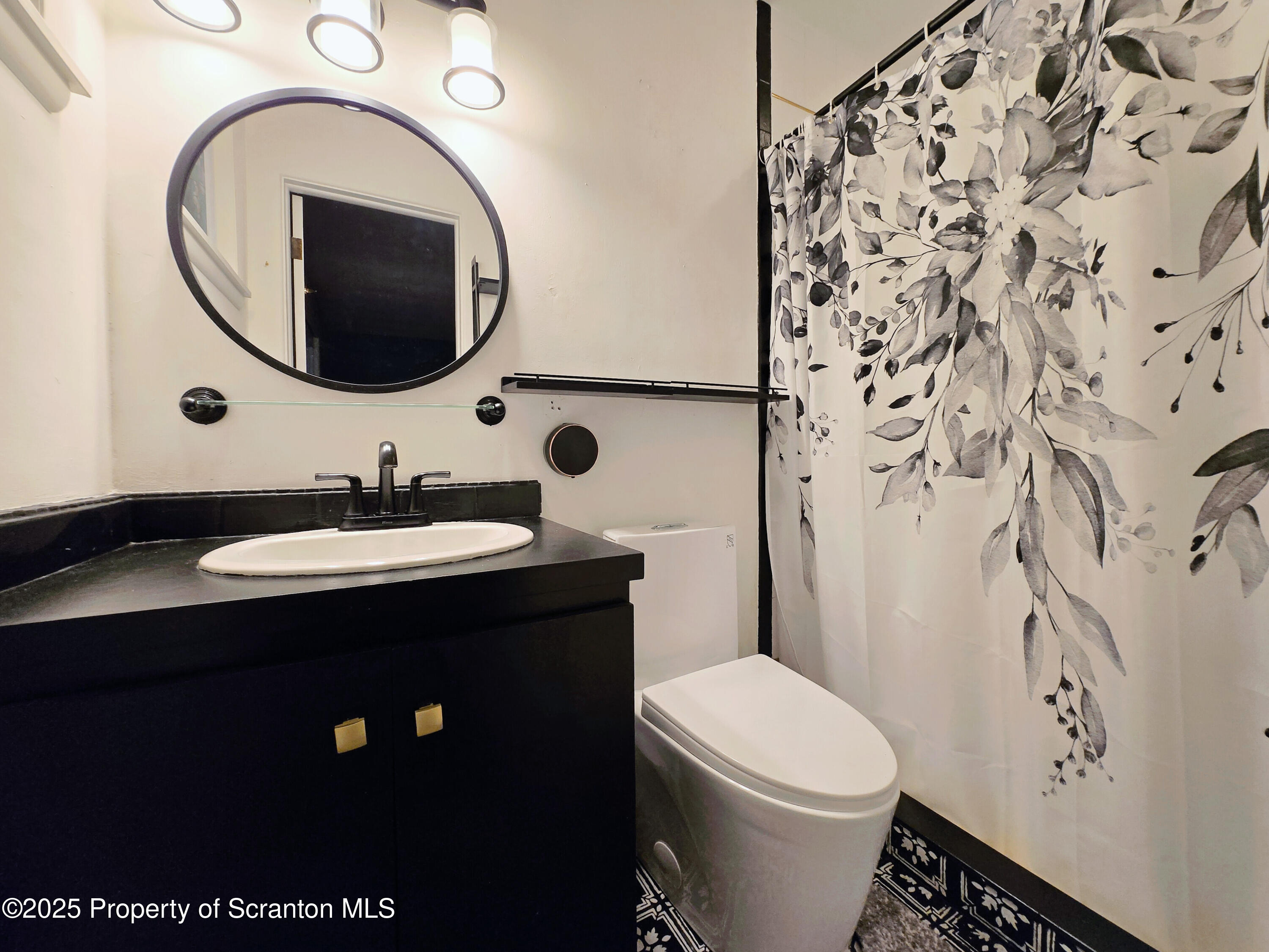 215 Lake Scranton Road Scranton, PA 18505 - Photo 14 of 25 a bathroom with a sink and a mirror