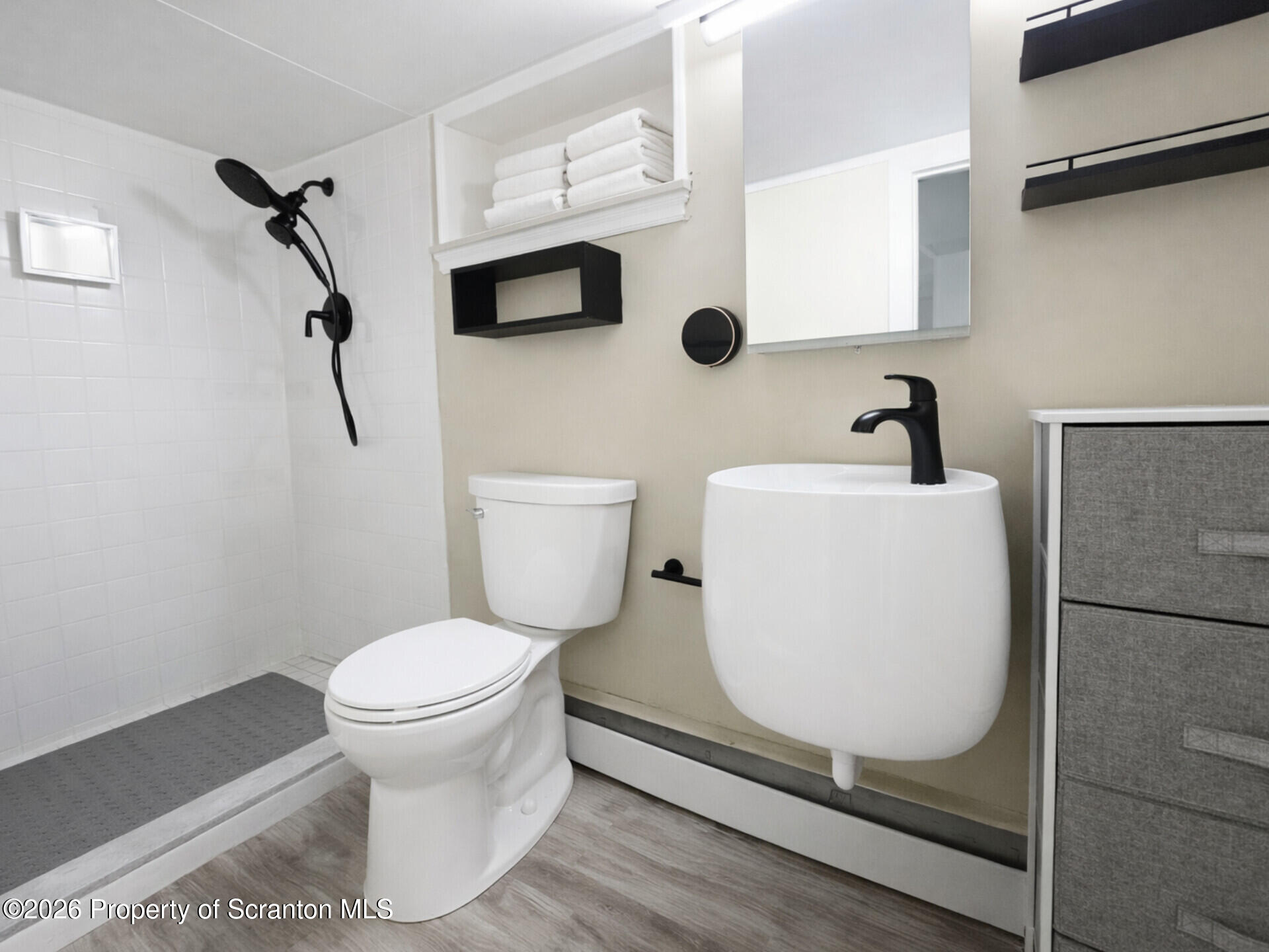 215 Lake Scranton Road Scranton, PA 18505 - Photo 21 of 25 a bathroom with a toilet and a sink