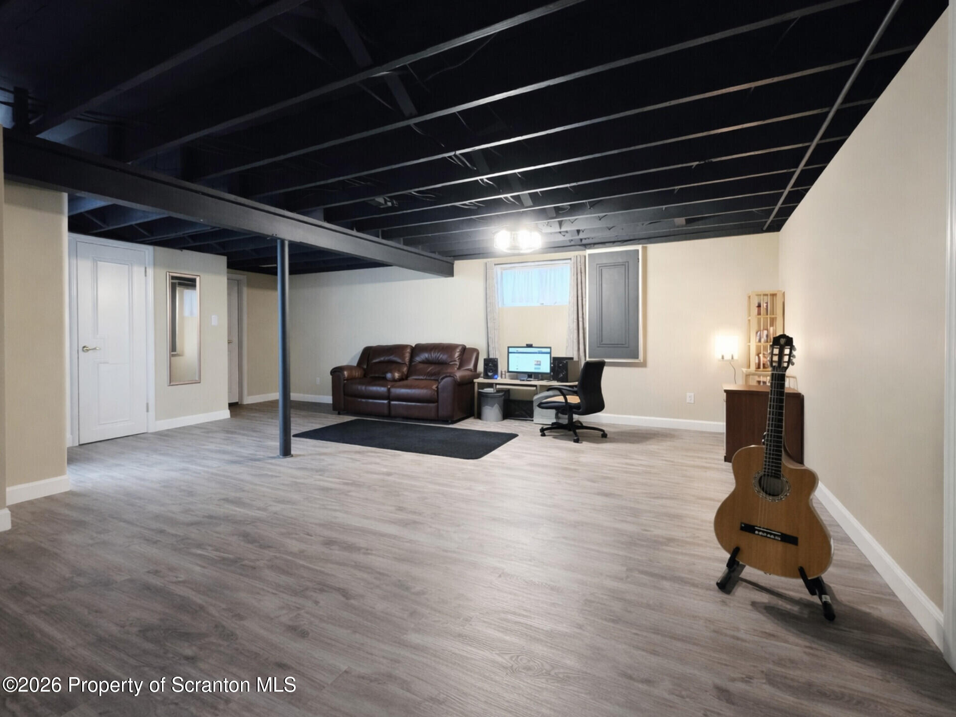 215 Lake Scranton Road Scranton, PA 18505 - Photo 22 of 25 a living room with furniture gym equipment and a table