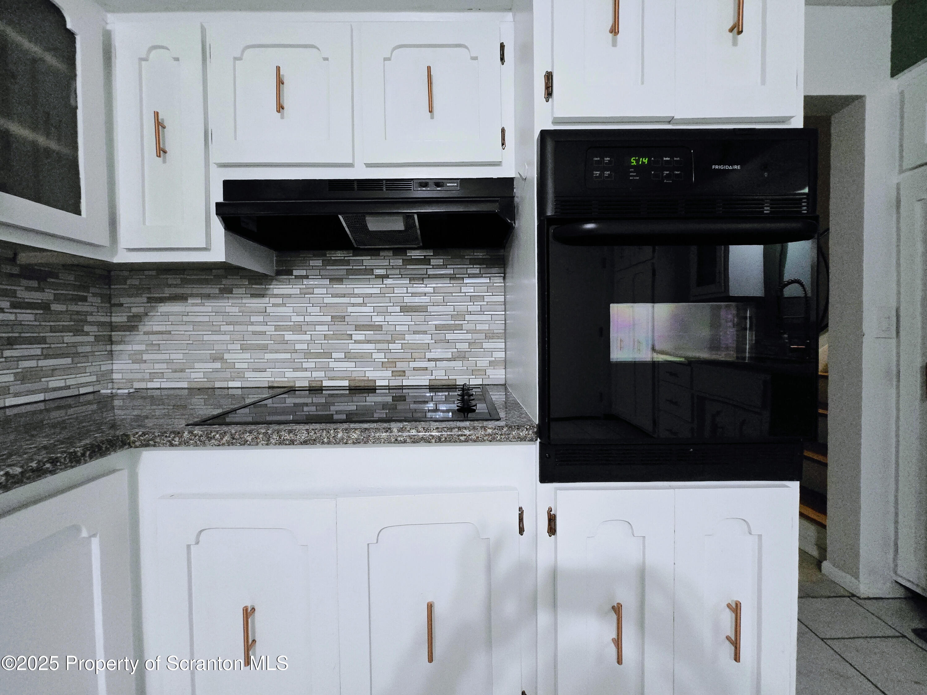 215 Lake Scranton Road Scranton, PA 18505 - Photo 6 of 25 a kitchen with granite countertop white cabinets and stainless steel appliances