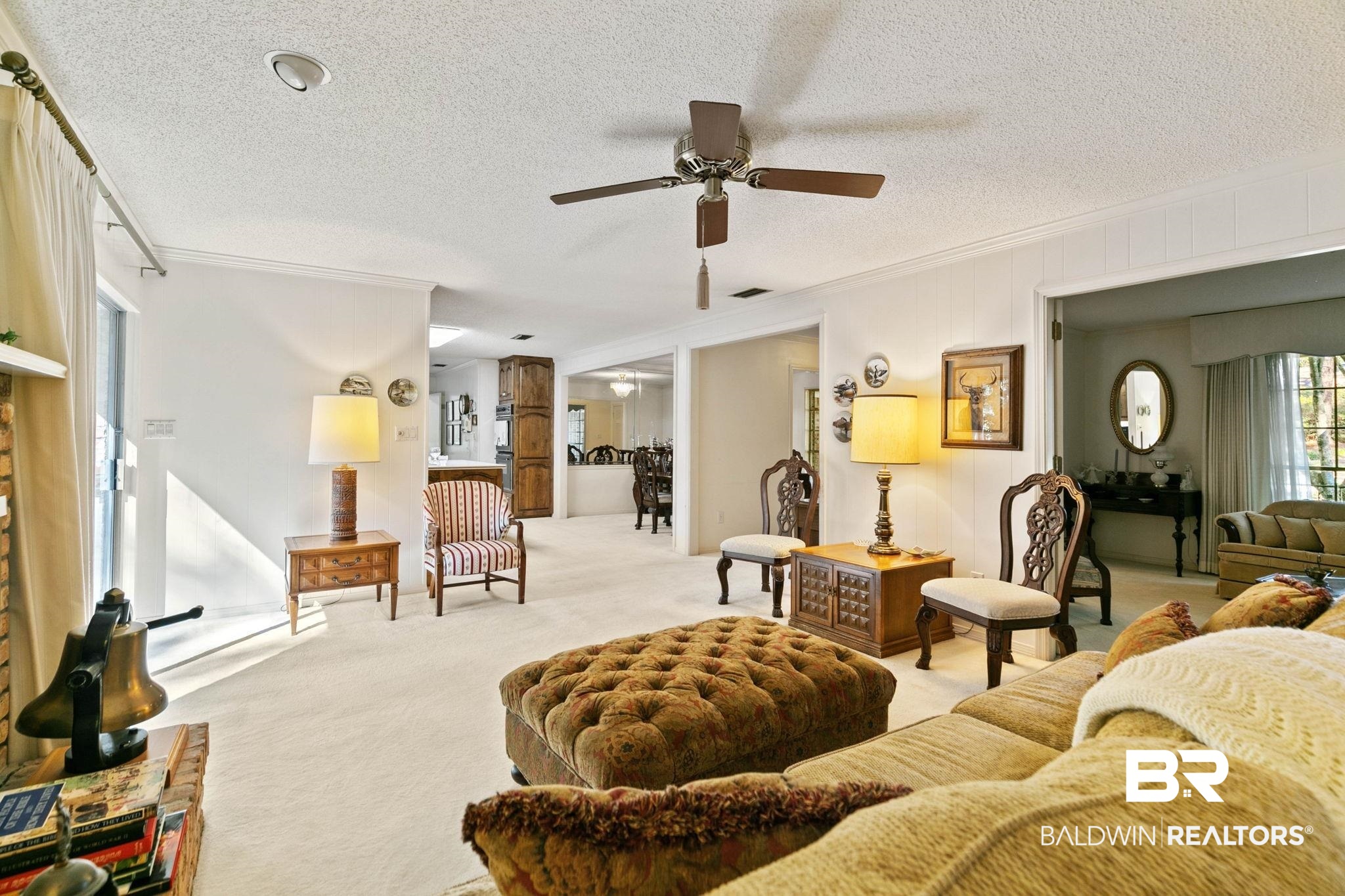 752 Evergreen Street Fairhope, AL 36532 - Photo 22 of 100 Carpeted living area with ornamental molding, a textured ceiling, and a ceiling fan