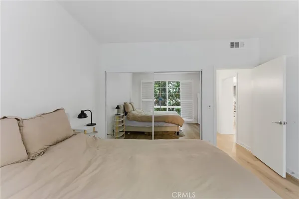a bed room with a bed and a window