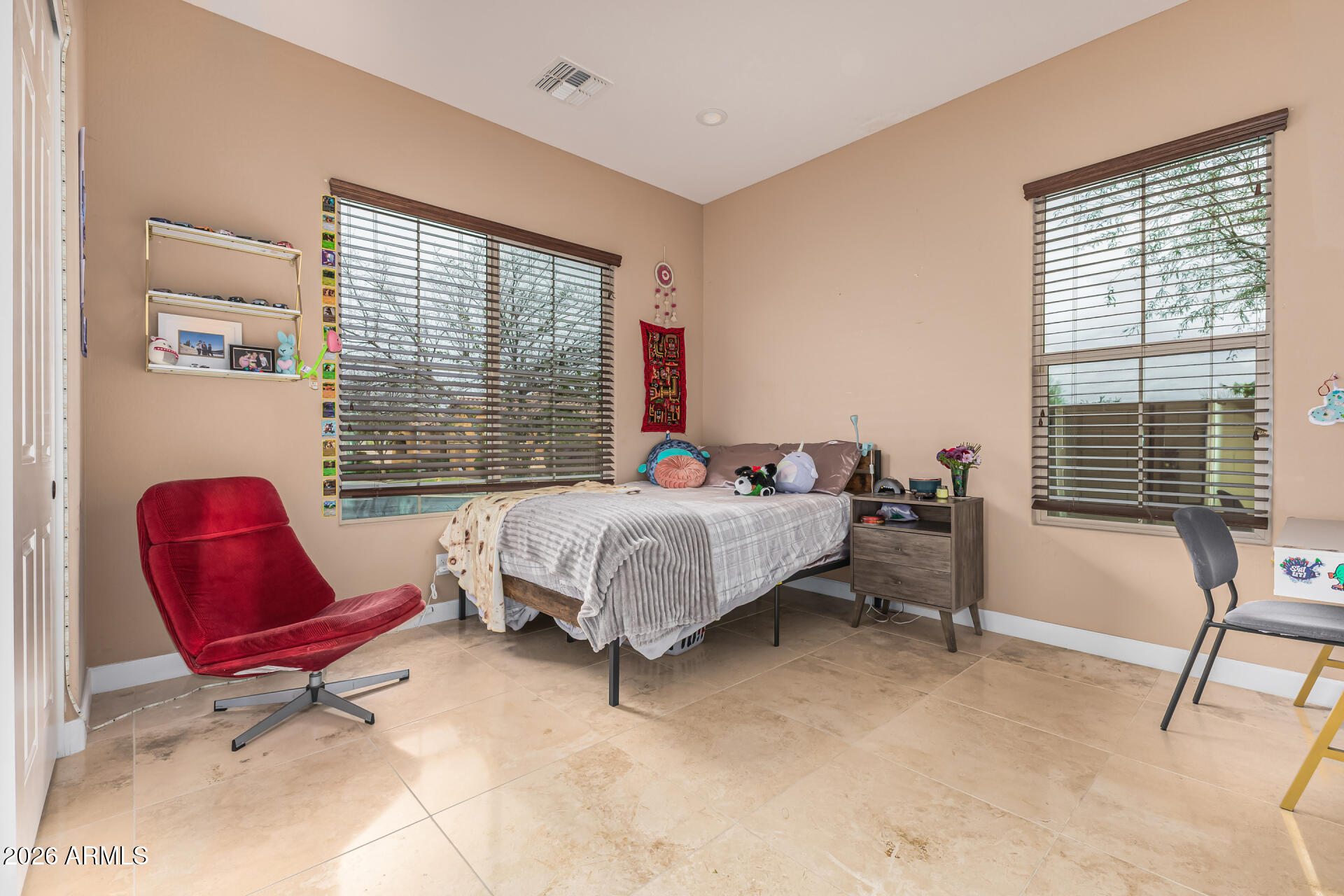 3139 East Harwell Road Phoenix, AZ 85042 - Photo 24 of 45 a bedroom with a bed a chair and next to a window