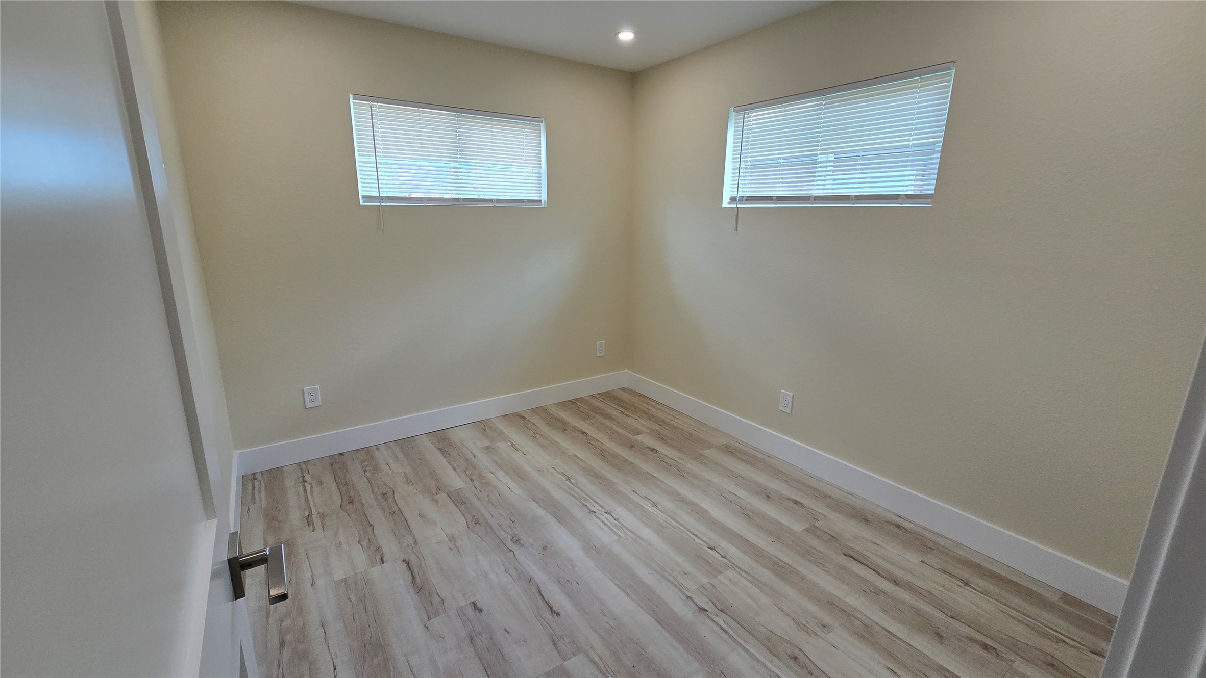 3741 Seabrook Street Houston, TX 77021 - Photo 45 of 50 an empty room with wooden floor and windows