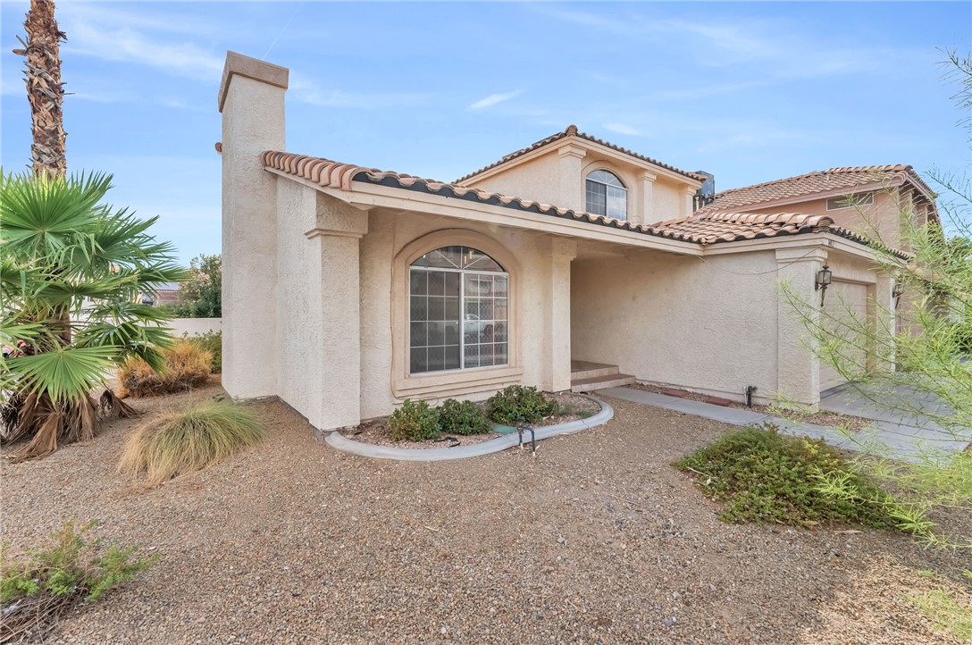 1402 Rim Fire Circle Henderson, NV 89014 - Photo 46 of 48 Classic Mediterranean architecture defined by a Spanish tile roof and smooth stucco finishes.