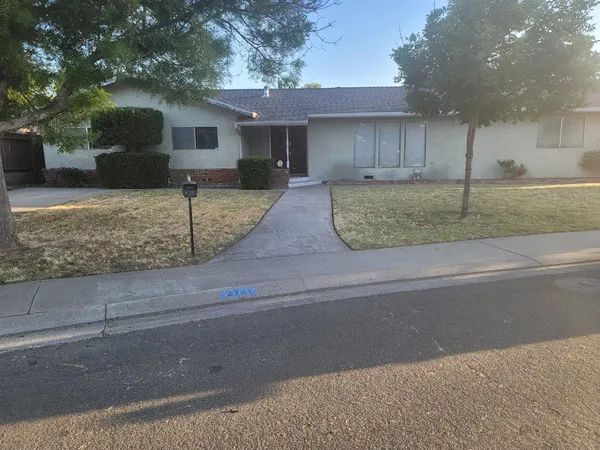 a front view of house with garage and yard