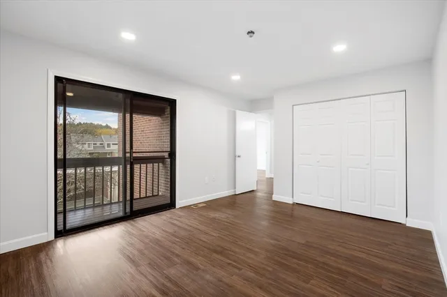 a view of entryway with wooden floor