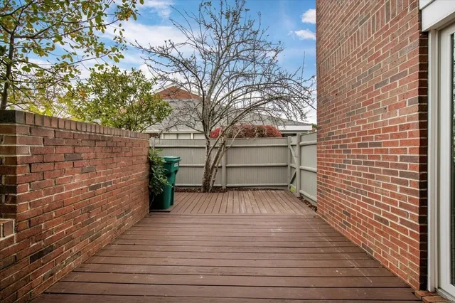 a view of outdoor space with deck and tree