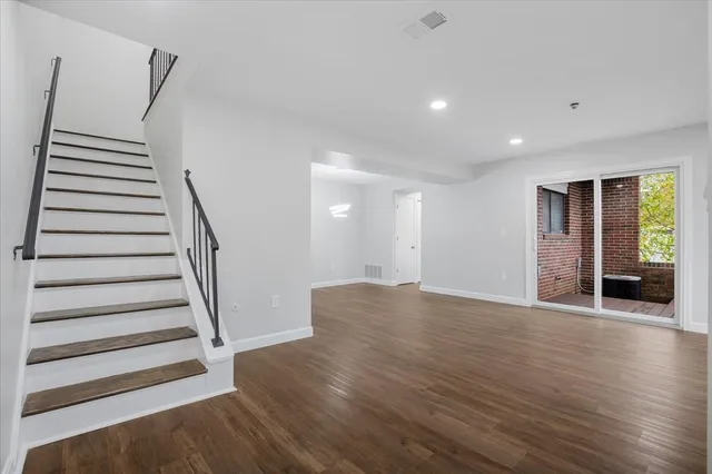 a view of entryway with wooden floor