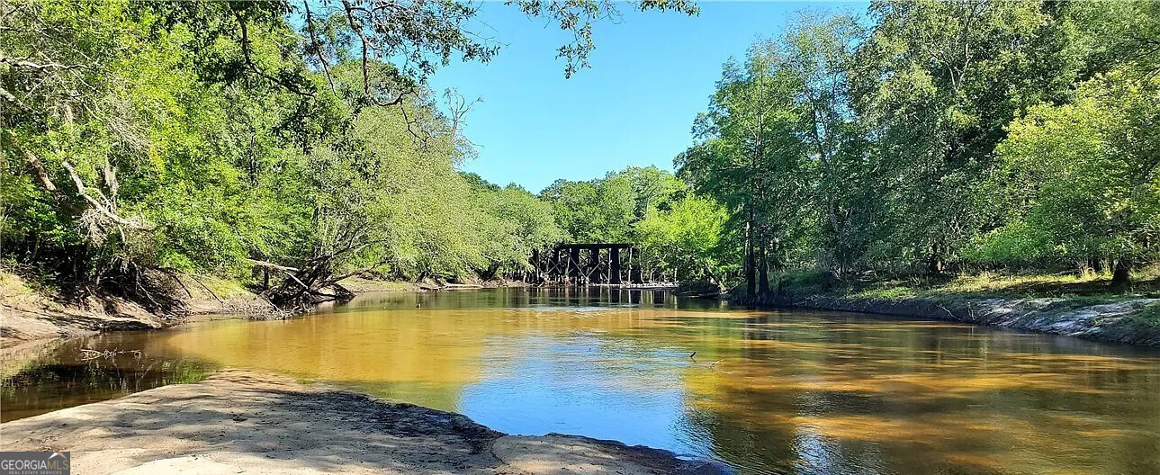 a view of a swimming pool with an outdoor space and seating area