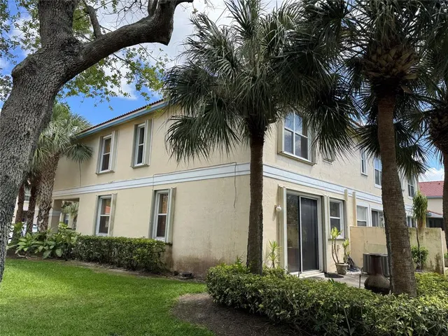 front view of a house with a garden