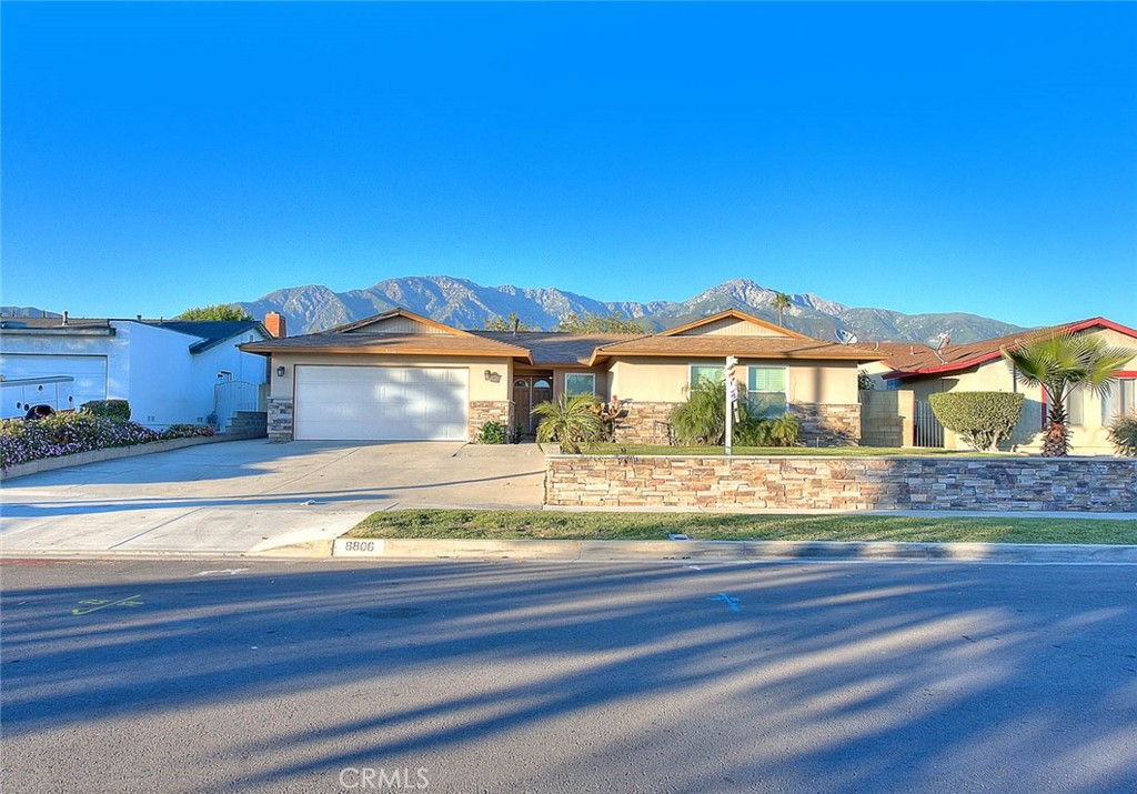 8806 Holly Street Rancho Cucamonga, CA 91701 - Photo 1 of 1 a view of a house with a yard
