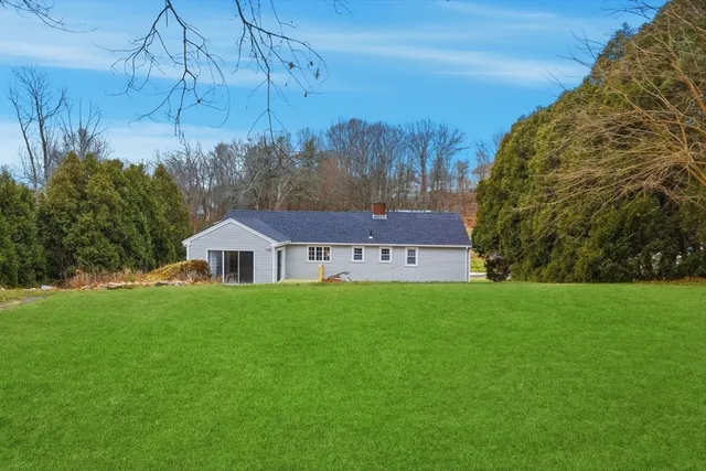 a view of a house with a big yard
