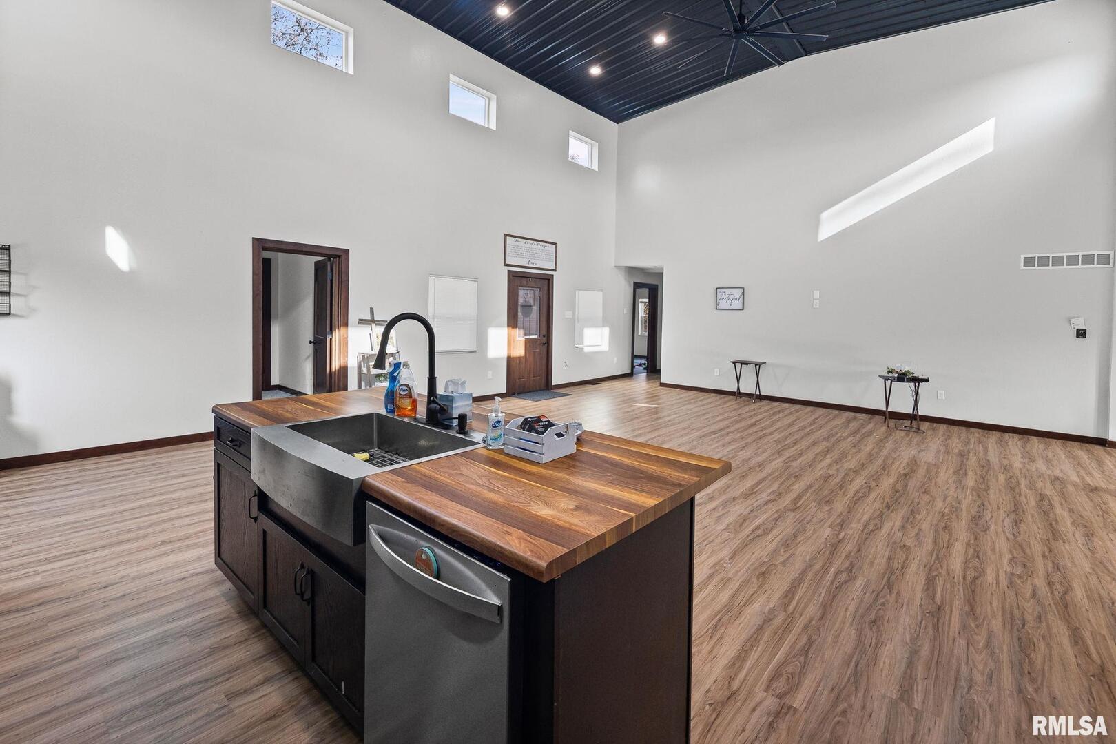 7984 Wilson Road Kinmundy, IL 62854 - Photo 16 of 36 a kitchen with a sink and wooden floor