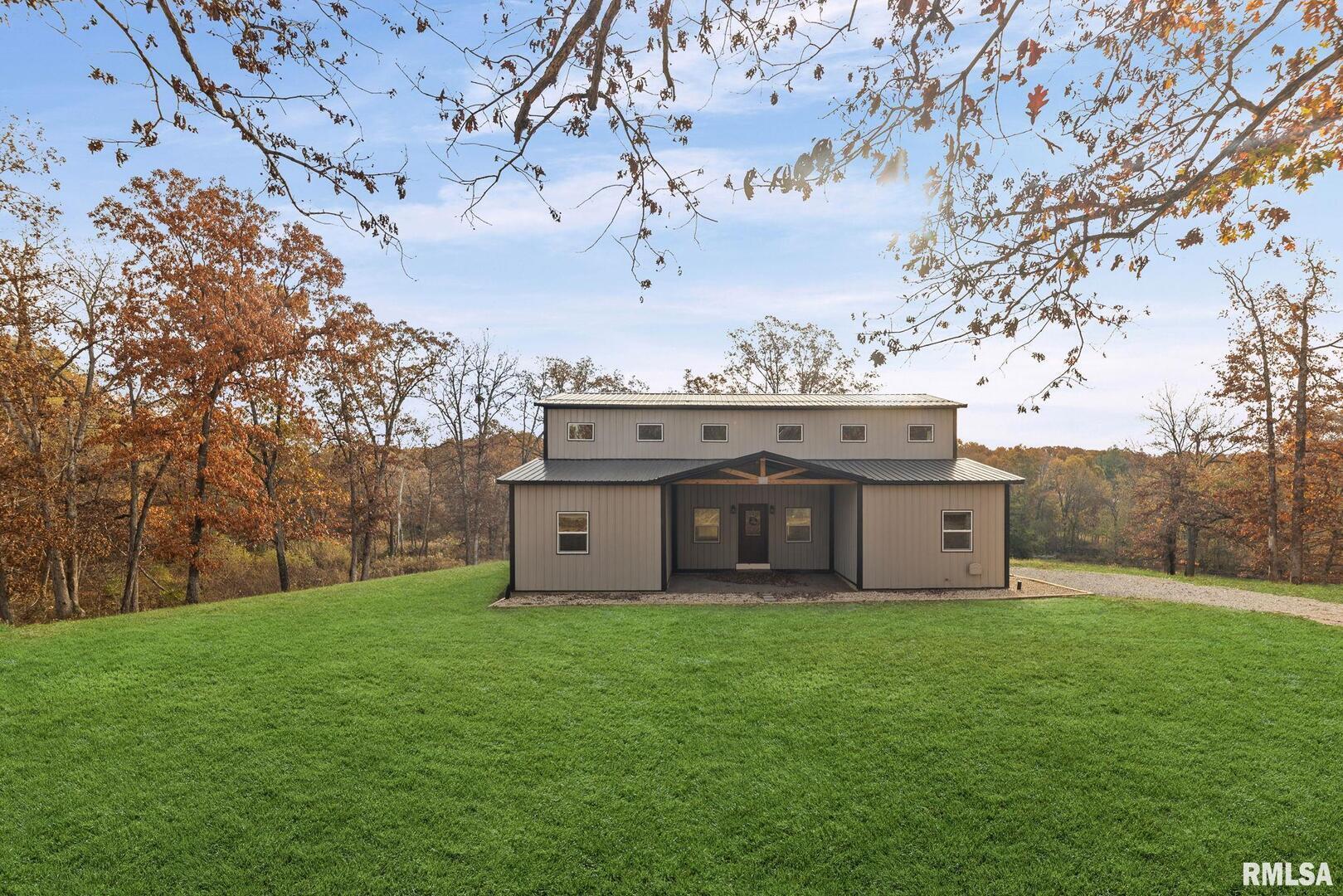 7984 Wilson Road Kinmundy, IL 62854 - Photo 2 of 36 a view of a big yard with a large tree