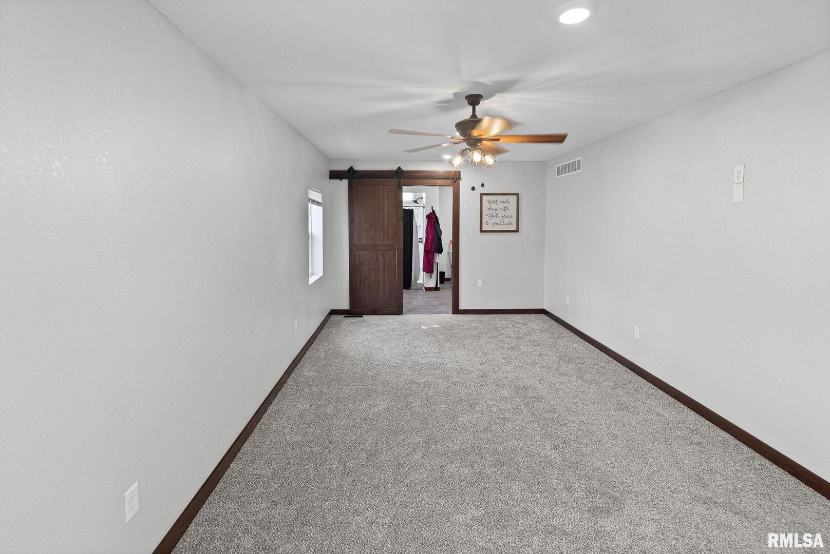 7984 Wilson Road Kinmundy, IL 62854 - Photo 22 of 36 wooden floor in an empty room with a window