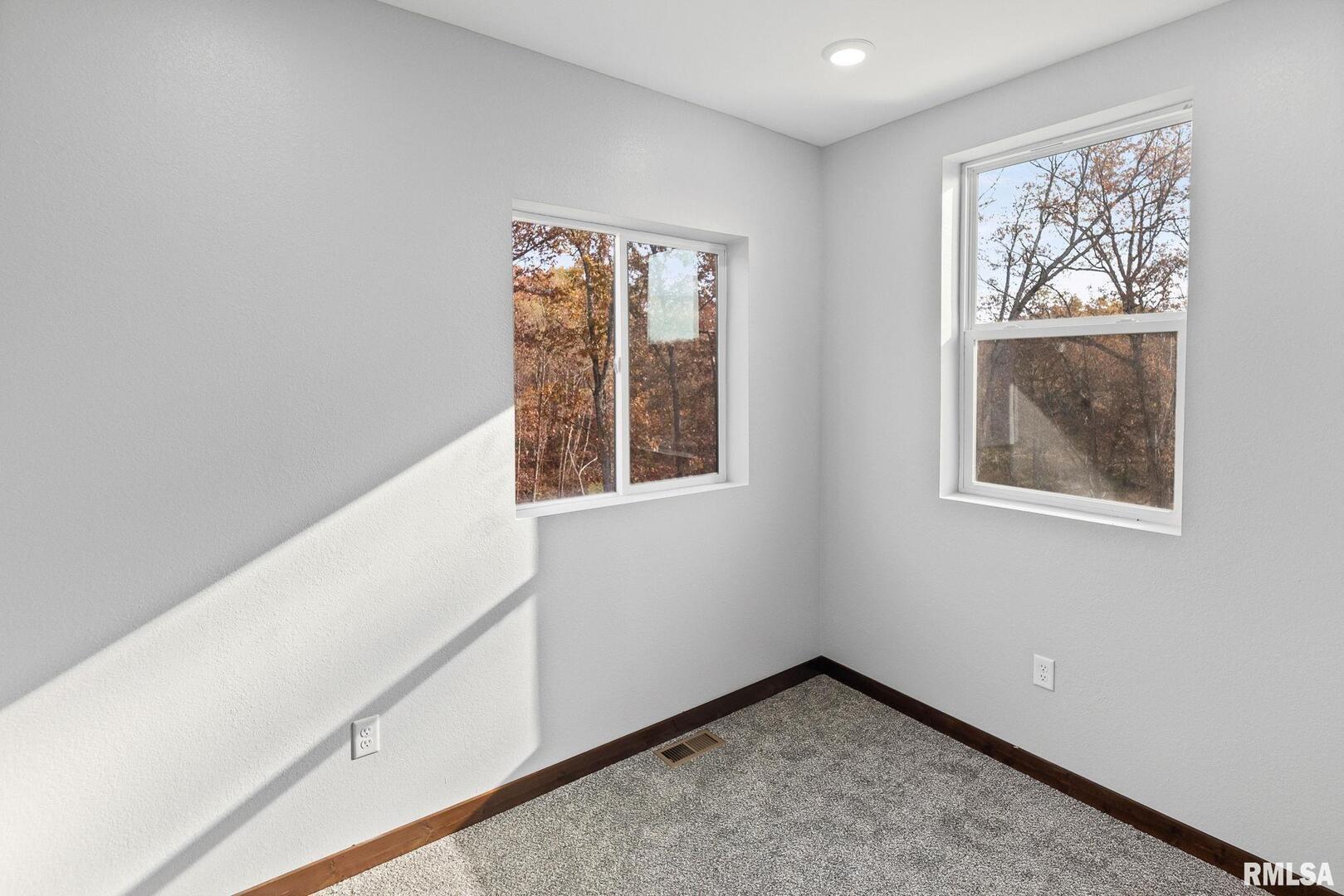 7984 Wilson Road Kinmundy, IL 62854 - Photo 26 of 36 a view of an empty room with a window