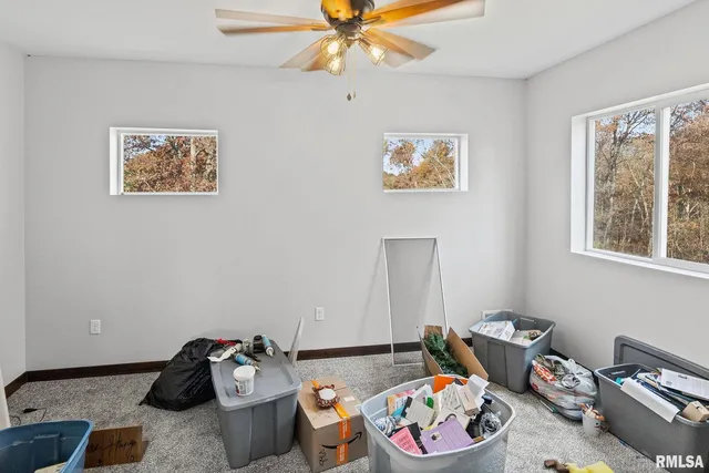 a livingroom with toys and a chandelier