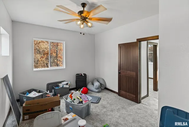 a livingroom with toys and a chandelier