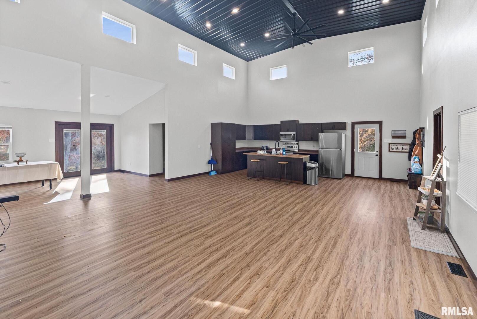 7984 Wilson Road Kinmundy, IL 62854 - Photo 7 of 36 a living room with furniture and a wooden floor
