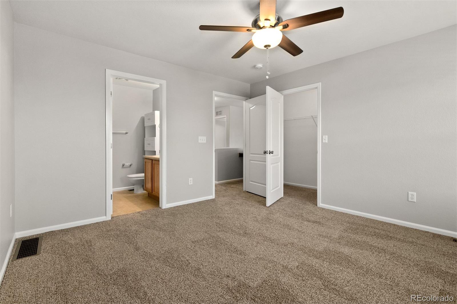 2562 Coach House Loop Castle Rock, CO 80109 - Photo 11 of 20 an empty room with closet and a ceiling fan
