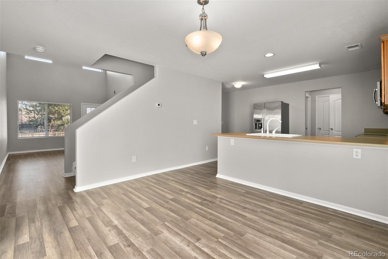 2562 Coach House Loop Castle Rock, CO 80109 - Photo 5 of 20 a view of a kitchen from the hallway