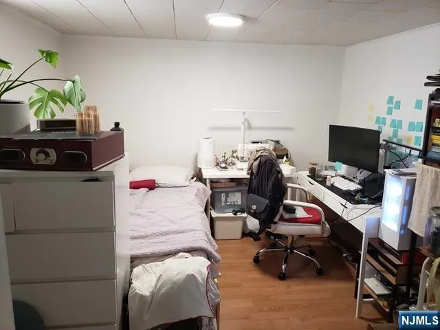 a bedroom with a workspace