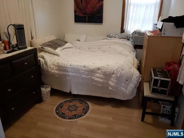 a bedroom with a bed and cabinets