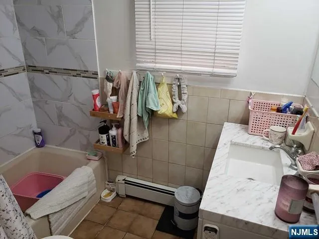 a bathroom with a sink and toilet