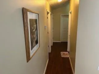 a view of a bathroom from a hallway