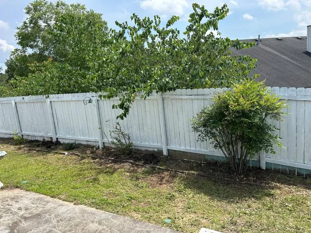 a backyard of a house with lots of green space