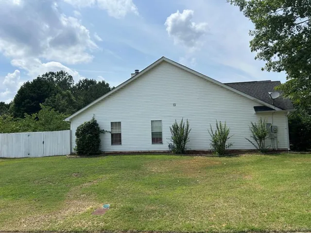 a house view with a garden space