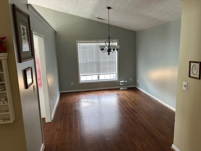 a view of livingroom and hardwood floor