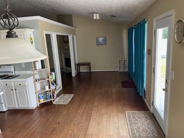 a view of an entryway with wooden floor