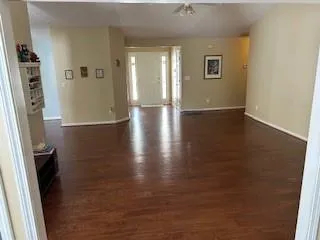 wooden floor in a hall with an entryway