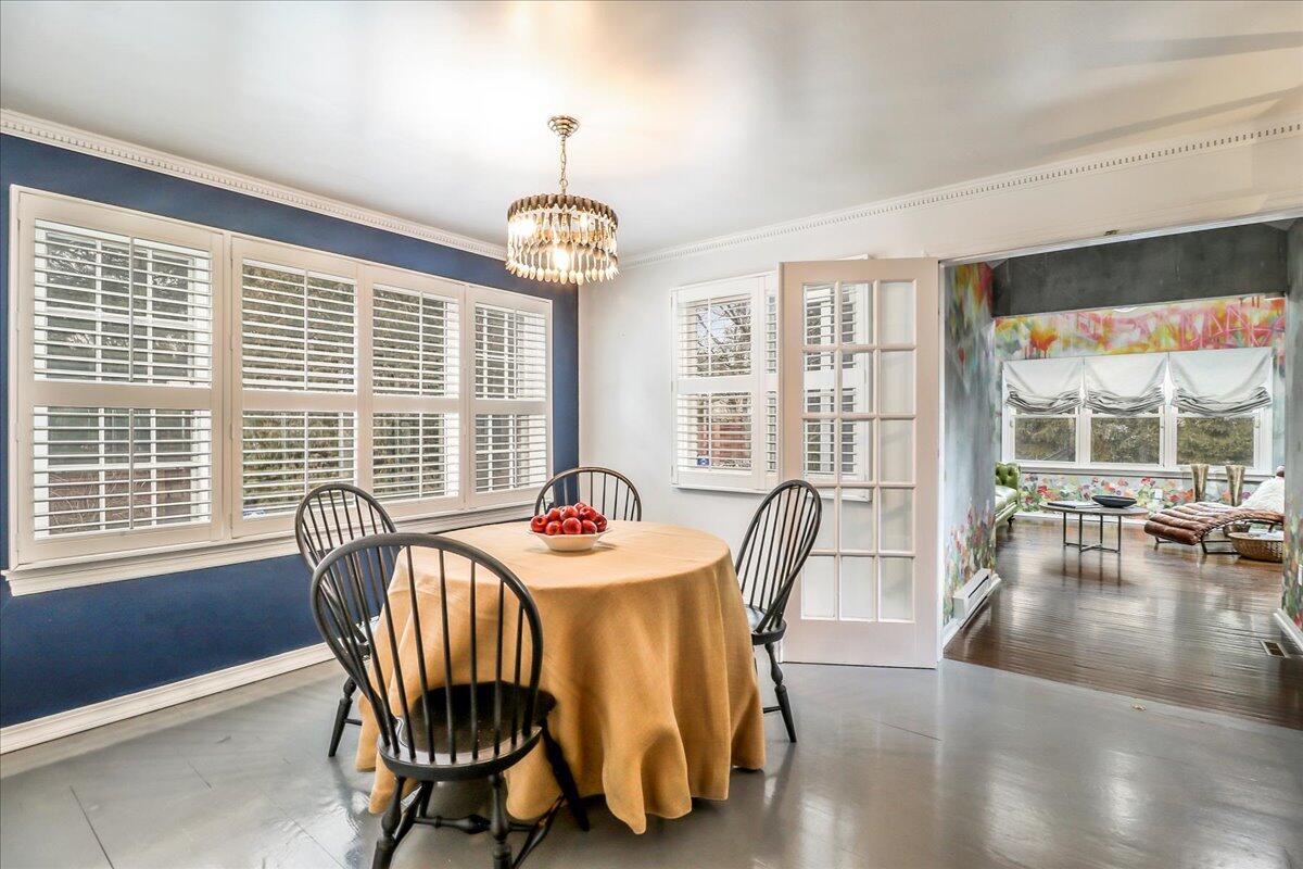 212 West Avenue Darien, CT 06820 - Photo 11 of 40 a view of a dining room with furniture wooden floor and chandelier