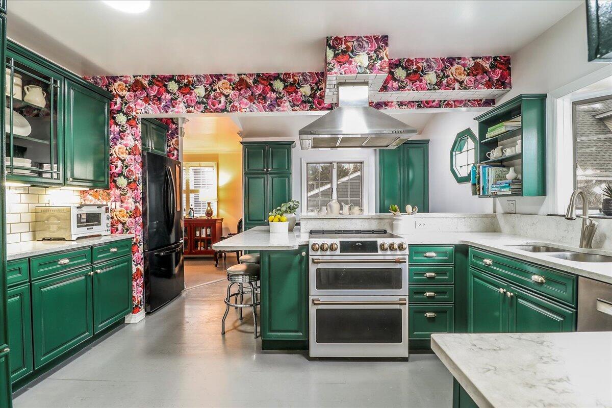 212 West Avenue Darien, CT 06820 - Photo 12 of 40 a kitchen with a stove and cabinets